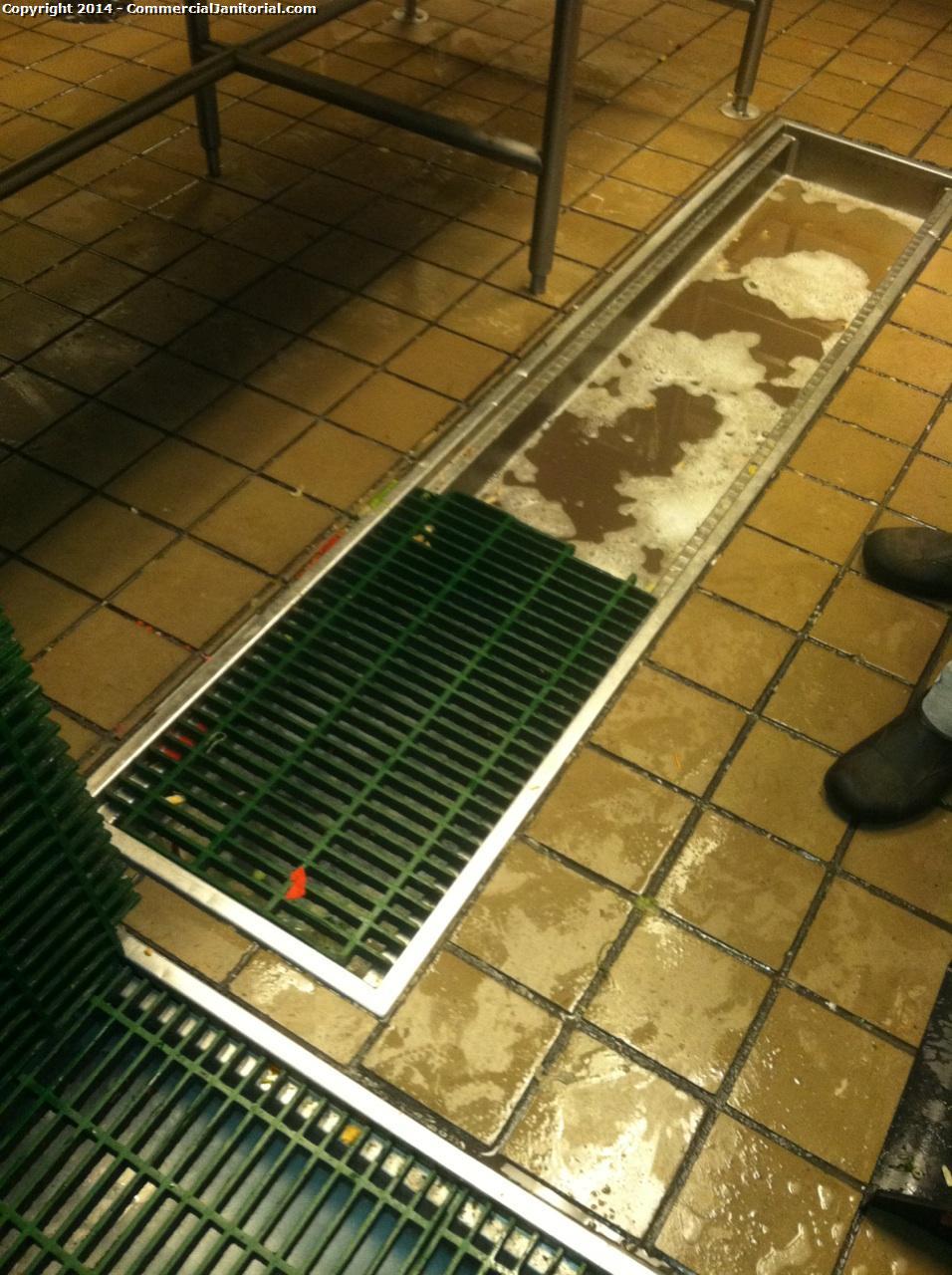 
2. The crew came in to find the drain in the dishwashing pit area clogged. They take a plunger to unclog it. This is a normal occurrence. See 2 photos.
