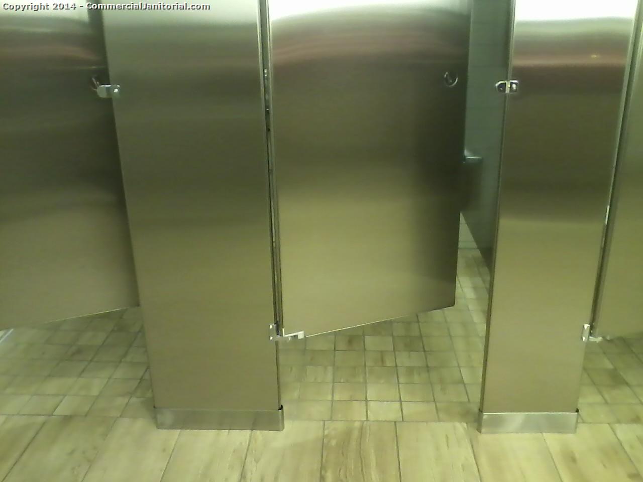 Bathroom stalls were cleaned, Toilets were cleaned inside and out ,    Doors are being cleaned with a stainless steel chemical 