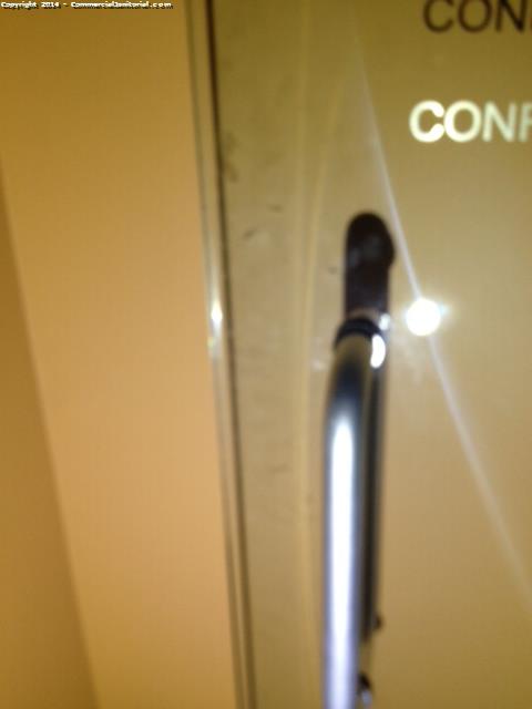 The glass doors have been cleaned with a special chemical , handle had been cleaned as well 