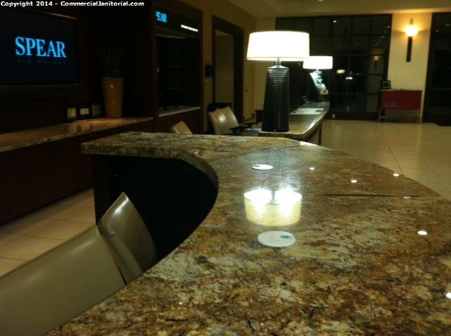  Reception desk granite counter top cleaning by the janitors and office cleaners