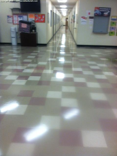 Scrub and waxing on the open hallway area 