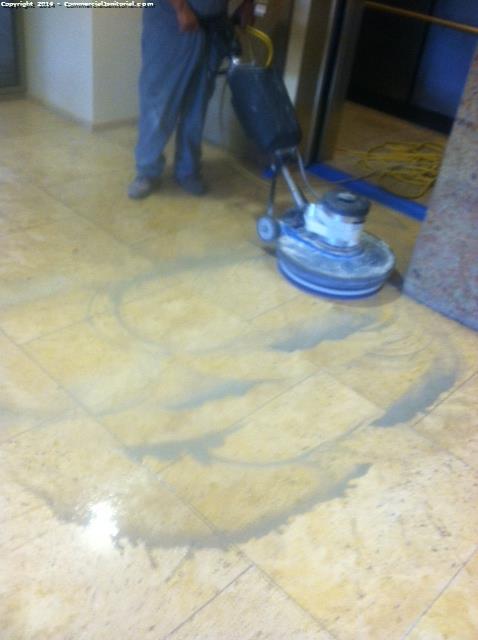 Cleaning the travertine floors before we polish them