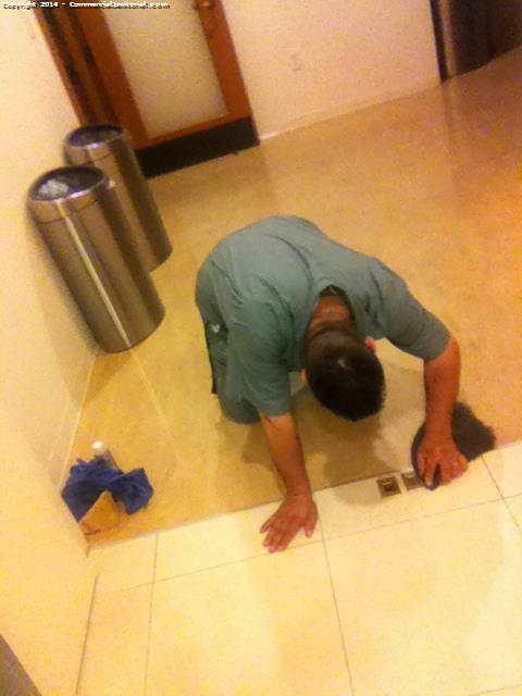 sanitizing around the tiles to make sure theres no unwanted marks 