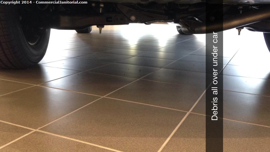

Tile floors sweep and mop under the cars at dealership.