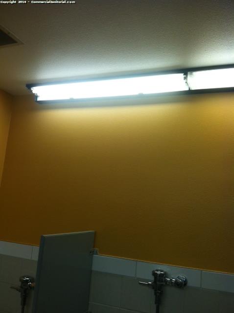 Lighting in the Restrooms was cleaned , the walls were wiped down , Urinals were cleaned inside and out 