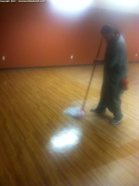 floor crew mopping & shinnying the floors after construction 