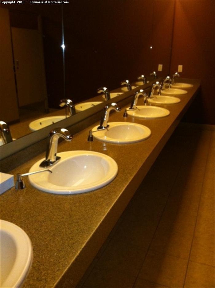 This is the picture representing the concept of cleaning the sink in a public restroom. Our crew uses hygienic solution and methods to clean the sink. We clean not only sink but also glass windows and  latrine.

