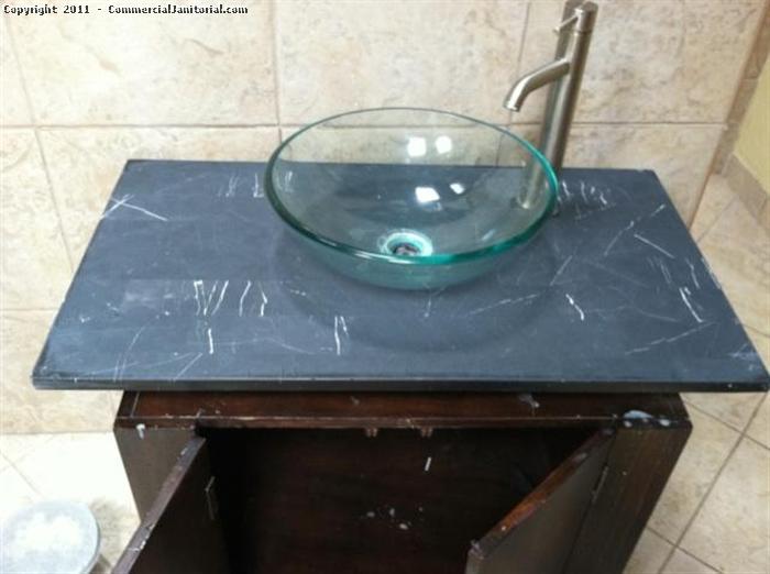 A during picture of a Marble sink counter as part of the polishing process. For this natural stone care, be sure to check out the before and after pictures.