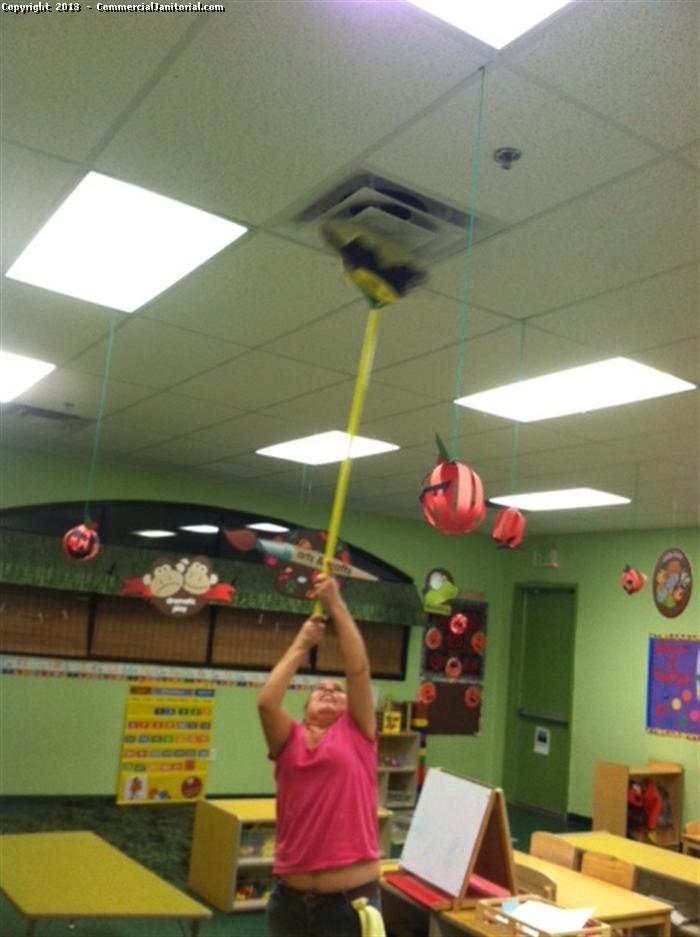 Commercial Janitorial staff is using long brush to clean the dust in the ceiling in Pre-School. It is the place of kid playing should be free from infection and virus. Our crew cleans and maintain every day.