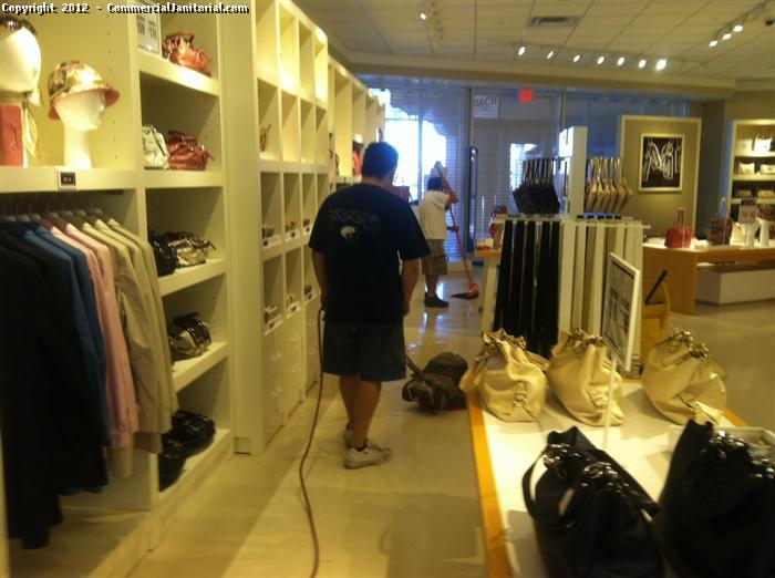 Cleaning the Coach store using a team operation, mopping and buffing the floor to a brilliant shine. If the floor is dirty, then the products look dirty. Cleaning a floor will boost perception and sales.