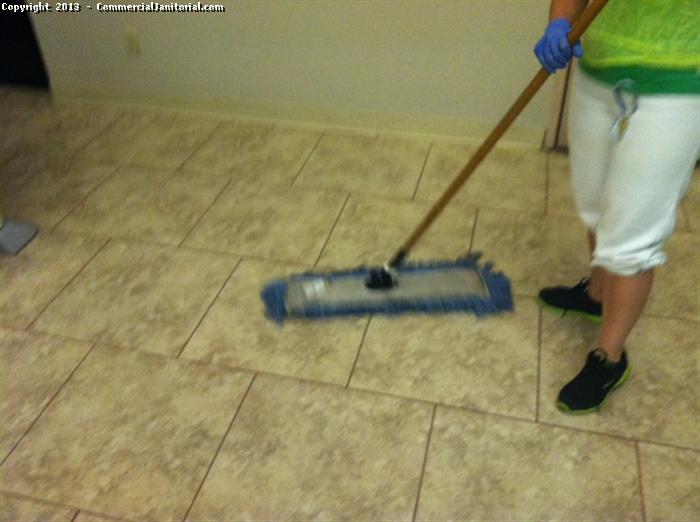 Our janitorial trained experts can clean, restore and protect your tile floors, making them look like new and hassle-free. This is the picture our crew cleans the tile using mop. Call us to get appointment.