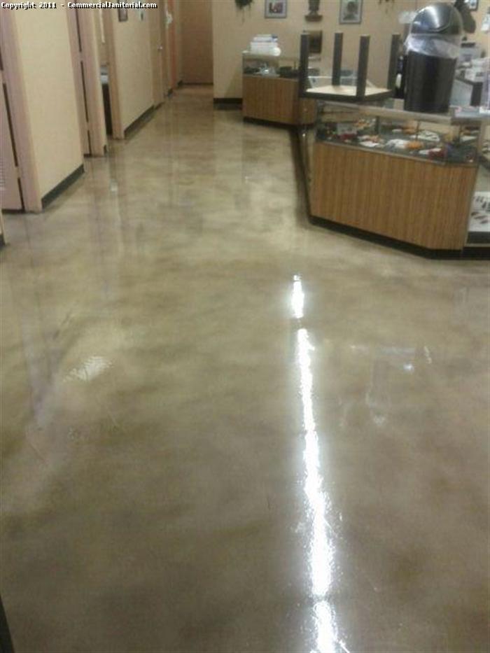 This picture was taken after the stain concrete floor was gloss waxed.