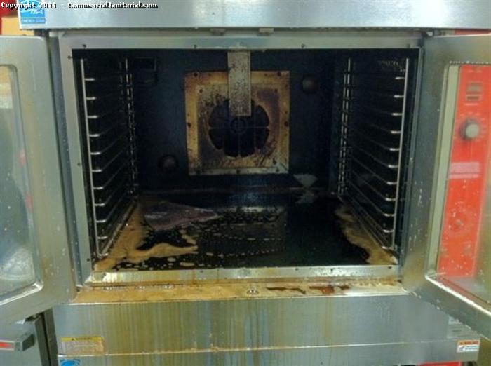 This is a before picture of a dirty kitchen convention oven.