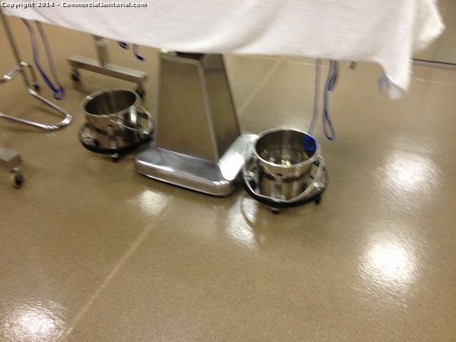 Underneath one of the exam tables we gave it a basic wipe down using stainless steel chemical , floors have been moped 