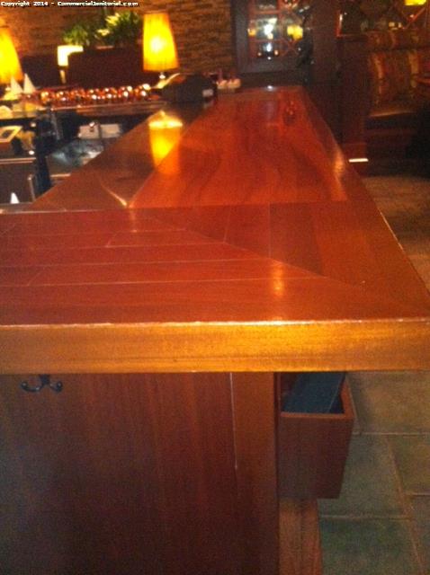 The top of the bar area counter has been cleaned and disinfected . 