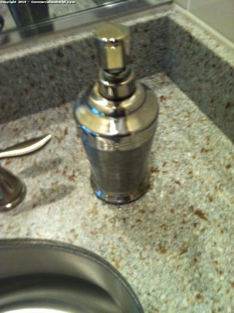 Filling a soap dispenser when cleaning a bank