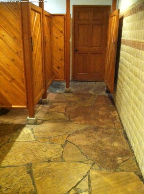 Restroom with unique tile floor. Cleaning crew need specific instructions to clean the surface.