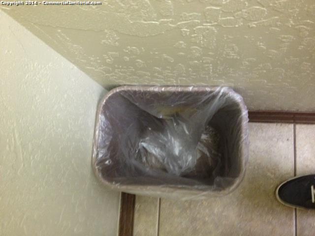 All trash was emptied before applying a new bag and leaving the facility 
