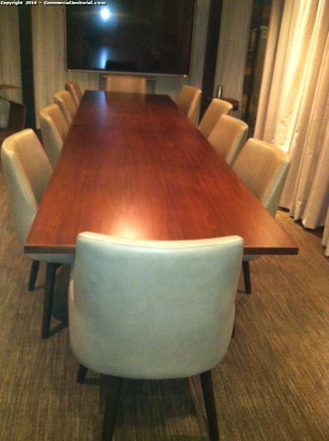 Cleaner presented inspection on clean table & chairs in conference room. using multi-purpose cleaner. 