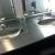 6/25/14- Clean and polish stainless steel sinks
