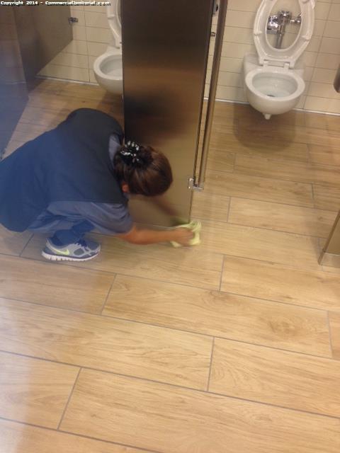 Detail cleaning the bases of restroom partitions are part of our nightly janitorial service