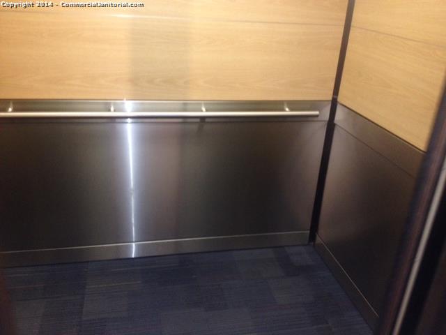 Cleaning the walls in an elevator