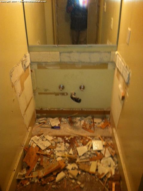Cleaning out a bathroom as part of a construction cleaning in a home