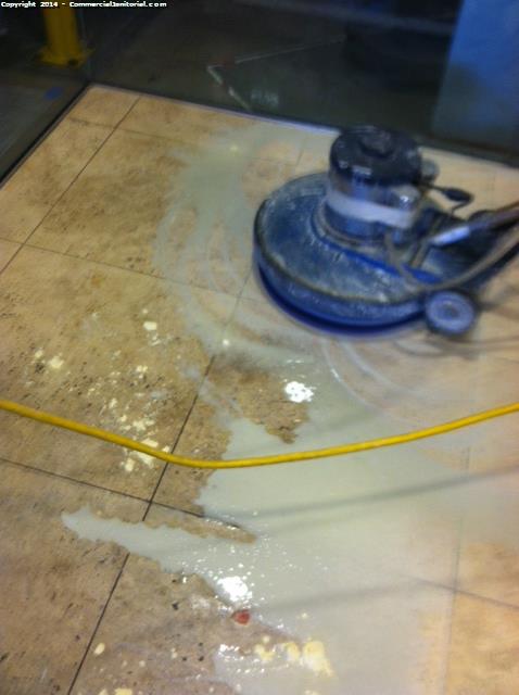 Using the wet process to clean stone floors in a Class A building