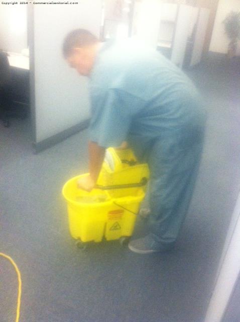 Here is our crew ringing out a mop in a mop bucket.

Great job Jesus.

Silvio G.