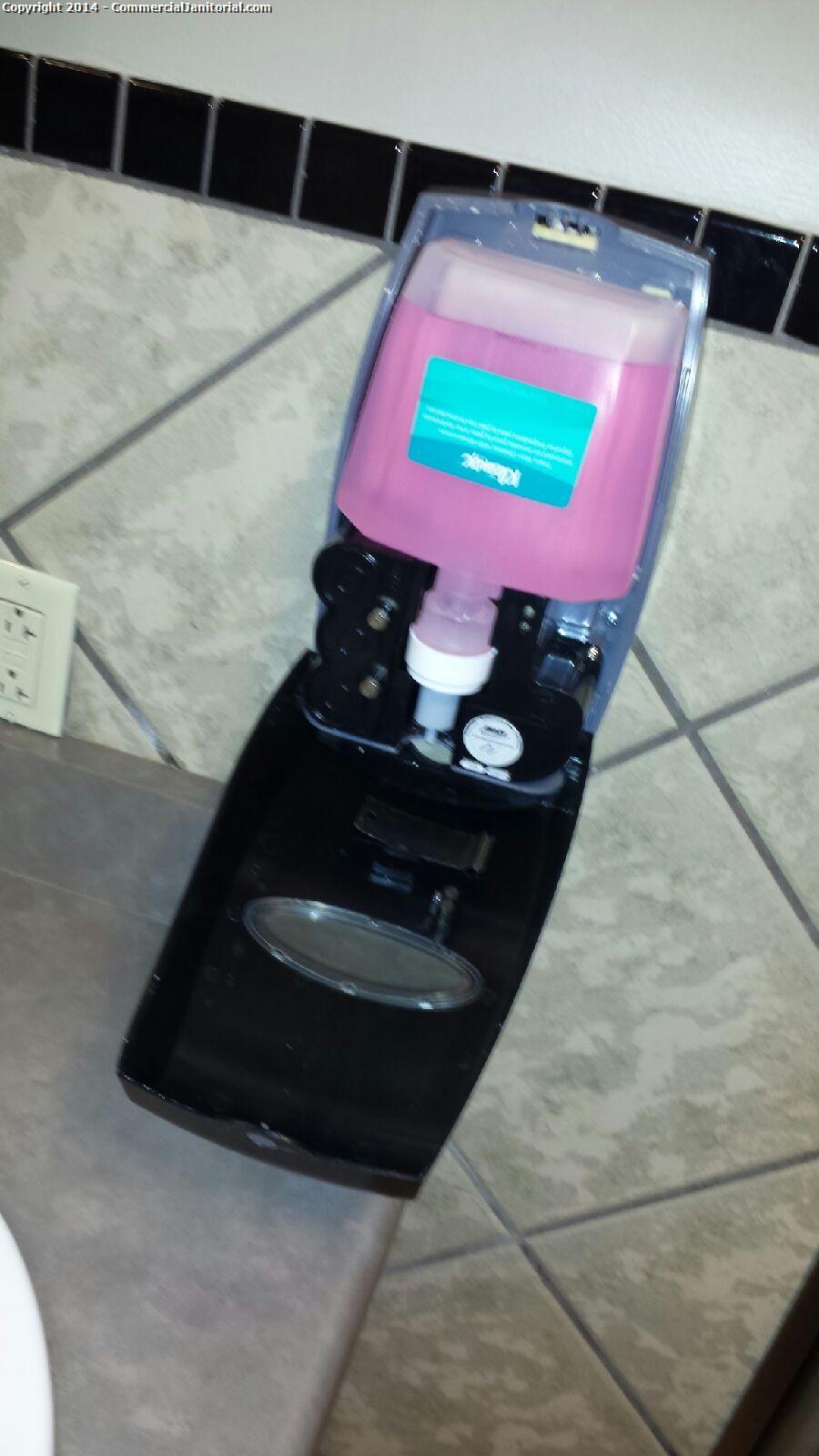 This soap dispenser in the mens restrooms was found broken. We taped up an it works for now. 